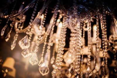 Close-up of illuminated lanterns hanging at night