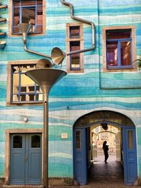 Rear view of woman walking in abandoned building