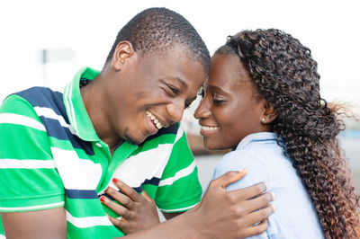 Portrait of couple kissing outdoors