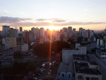 High angle view of buildings in city against sky during sunset