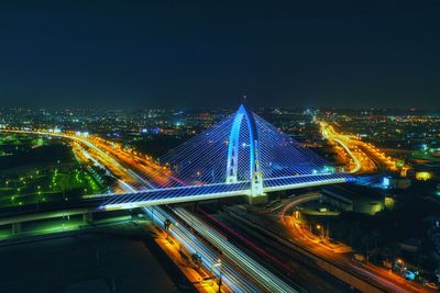 High angle view of illuminated bridge in city at night