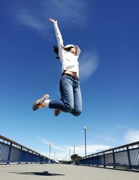 Low angle view of woman jumping