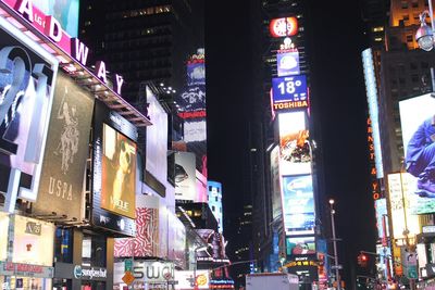 View of buildings in city at night