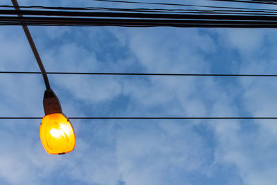 Low angle view of street light against sky