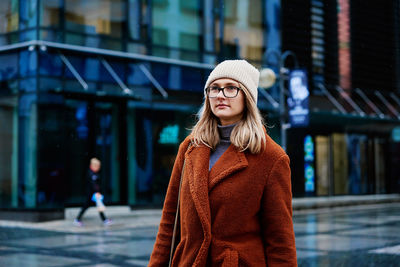 Woman walking at city street