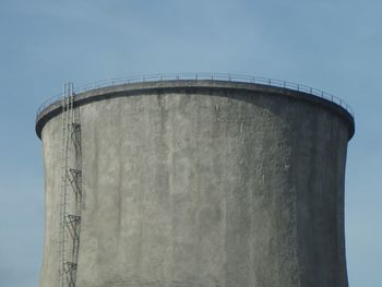 Low angle view of factory against clear sky