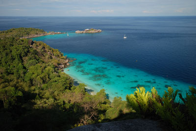 Scenic view of sea against blue sky