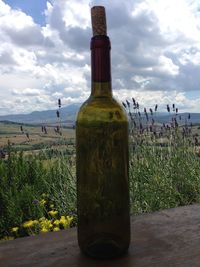 Lighthouse against cloudy sky