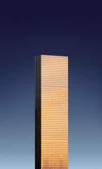 Low angle view of building against clear blue sky