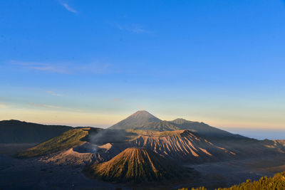 Scenic view of volcanic crater against sky