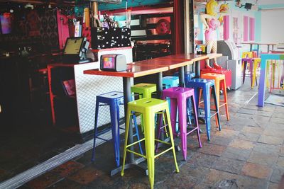 Multi colored chairs on table