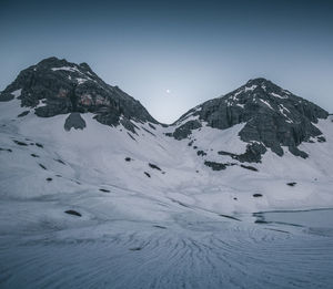 Scenic view of snowcapped mountain against sky