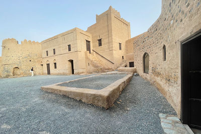 Low angle view of old ruins against clear sky