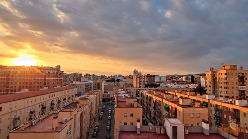 High angle view of cityscape against sky during sunset