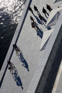 High angle view of people on floor against sky