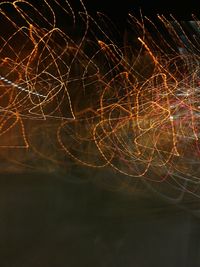 Close-up of fireworks against sky at night