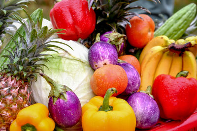 Close-up of various vegetables and fruits on crate