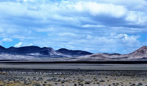 Scenic view of landscape and mountains against sky