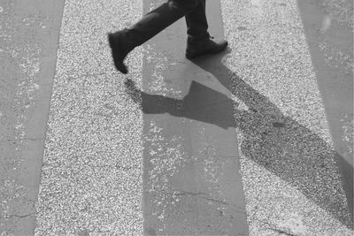 Low section of person standing on street