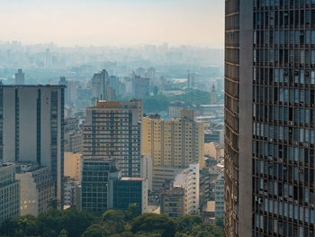 Modern buildings in city against sky