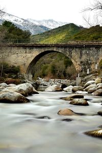 Arch bridge over river