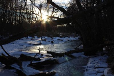 Scenic view of snow covered landscape during sunset