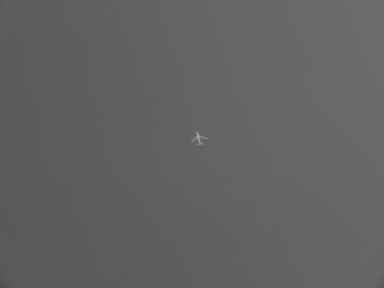 Low angle view of airplane flying in sky