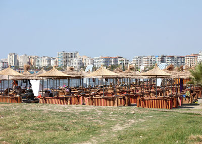 Buildings in city against clear sky