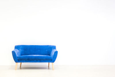 Empty chair against white background