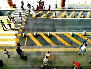 High angle view of people walking on street in city