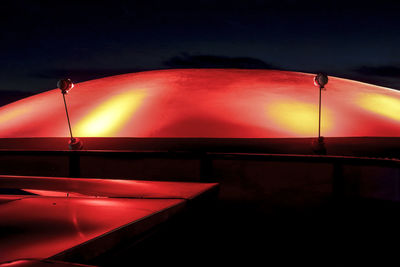 Illuminated red lights at night