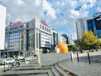 Street amidst buildings in city against sky