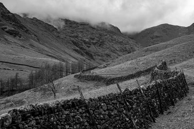 Wasdale head walk alongside stone wall 