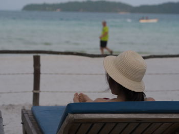 Rear view of woman looking at sea