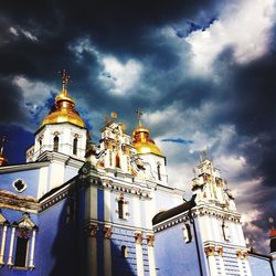 Low angle view of church against cloudy sky