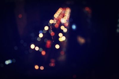 Close-up of illuminated lights at night