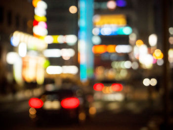 Defocused image of city lit up at night