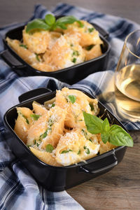 Pasta conchiglioni stuffed with spinach, ricotta and parmesan baked