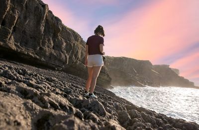 Rear view of woman looking at sea shore