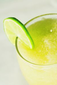 Close-up of lemon slice over white background