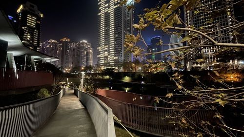 Illuminated modern buildings in city at night