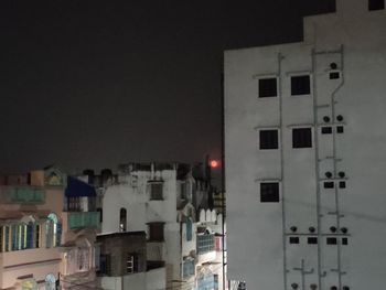 Buildings in city at night