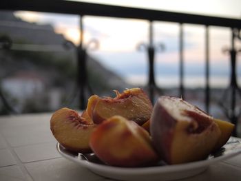 Close-up of fruits in plate on table