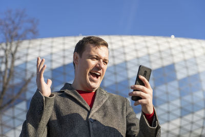 Young man using mobile phone