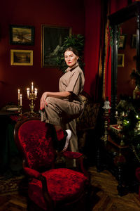 Portrait of woman sitting in traditional clothing