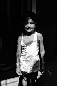 Portrait of smiling girl standing outdoors