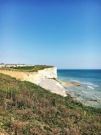 Scenic view of sea against clear blue sky