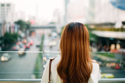 Rear view of woman in city