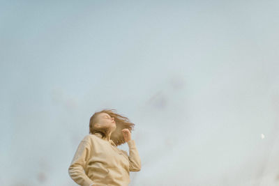 Portrait of a young woman on a sunny day in autumn