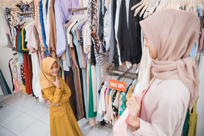 Mother and daughter shopping in mall